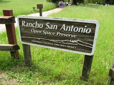 A sign welcoming visitors to Rancho San Antonio Open Space Reserve