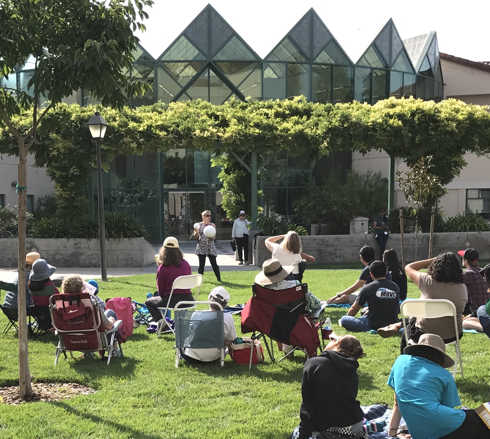 Dr. Kristin Kulas describing what causes solar eclipses during the viewing party.