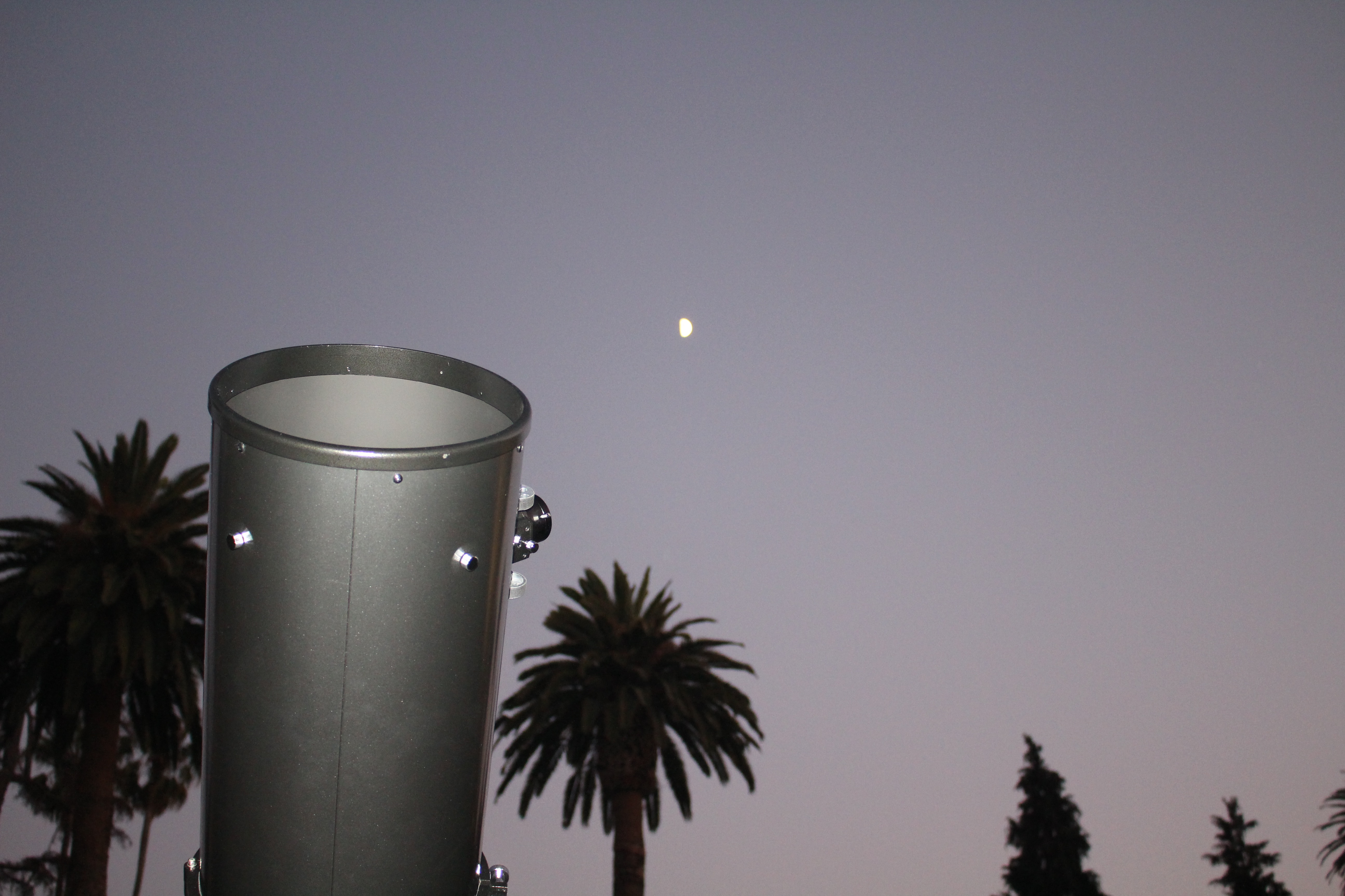 One of our ten inch telescopes with the Moon in the background.  The Moon was in the first quarter phase.